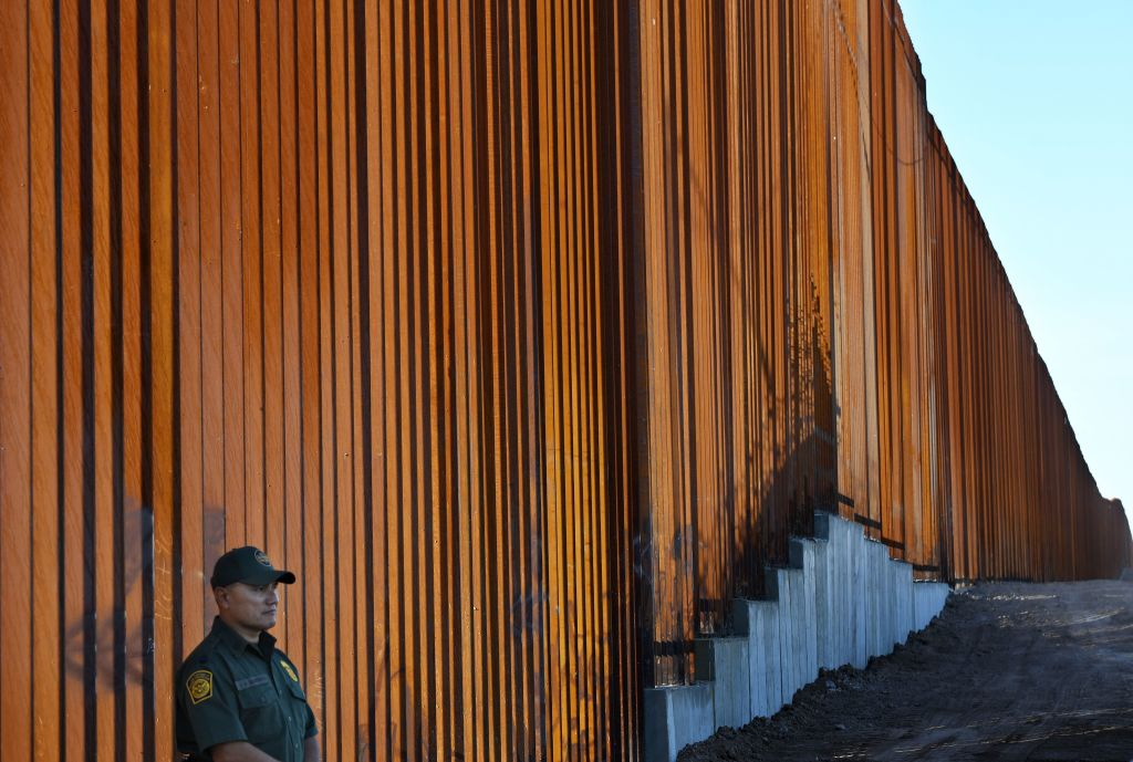 DHS cancels 2 Texas border wall projects 1 TOPSHOT - Border Patrol officers keep warch before U.S. Department of Homeland Security Secretary Kirstjen M. Nielsen inaugurates the first completed section of President Trumps 30-foot border wall in the El Centro Sector, at the US Mexico border in Calexico, California on October 26, 2018. (Photo by Mark RALSTON / AFP) (Photo credit should read MARK RALSTON/AFP via Getty Images)