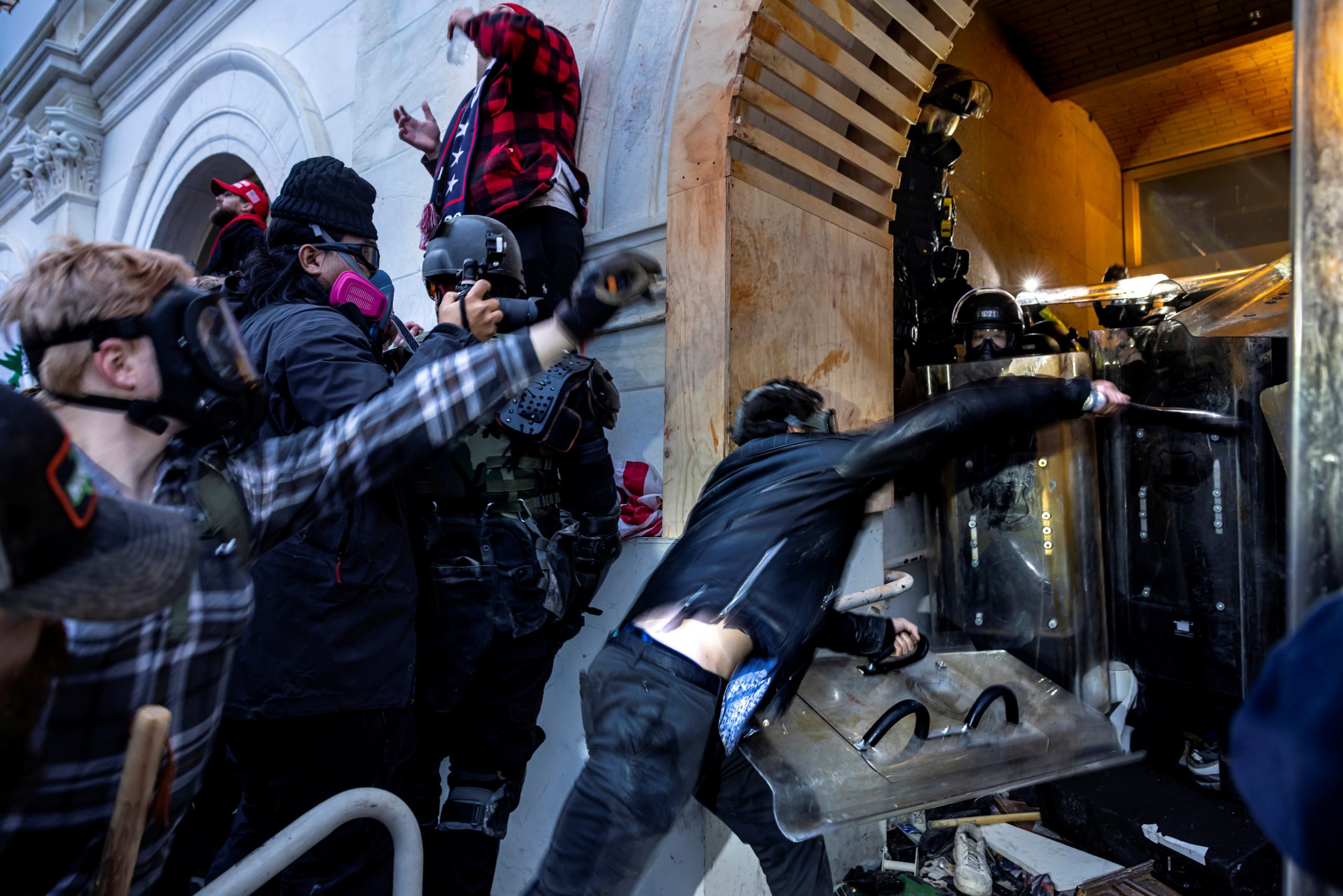 Trump supporters clash with police and security forces as people try to storm the US Capitol on January 6, 2021 in Washington, DC. - Demonstrators breeched security and entered the Capitol as Congress debated the 2020 presidential election Electoral Vote Certification. Many of them believed that election integrity was compromised (Photo by Brent Stirton/Getty Images)