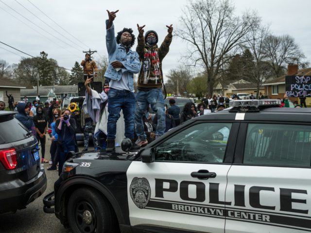 Nolte: Horrific Reality of Democrat Policies Red-Pilled America 2 People stand on a police cruiser as protesters take to the streets after Brooklyn Center police shot and killed Daunte Wright during a traffic stop on April 11, 2021 in Brooklyn Center, Minnesota. A crowd gathered to confront police as they held a line while investigators searched the scene. (Photo by Stephen Maturen/Getty Images)