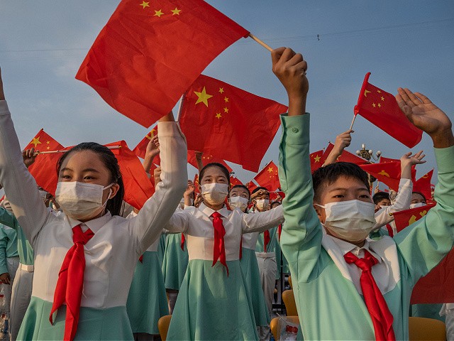 Chinese Diplomats Lecture Woke Harvard Elite: Don't Focus on 'Narrow-Minded' Americans 2 BEIJING, CHINA - JULY 01: Chinese students wave party and national flags at a ceremony marking the 100th anniversary of the Communist Party at Tiananmen Square on July 1, 2021 in Beijing, China. (Photo by Kevin Frayer/Getty Images)