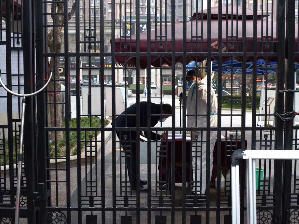 Don't Panic: China Rebrands Mounting Lockdowns as 'Static Management' 1 A security guard checks information of a resident at the entrance of a residental area that is under restrictions following a recent coronavirus outbreak in Xian, in China's northern Shaanxi province on December 23, 2021. - China OUT (Photo by AFP) / China OUT (Photo by STR/AFP via Getty Images)
