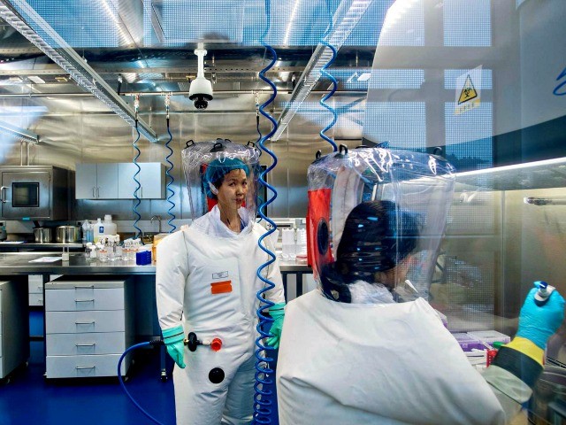 W.H.O. Head Tedros Carries Olympic Torch at Beijing Genocide Games 1 Inside the P4 laboratory in Wuhan in 2017.BY