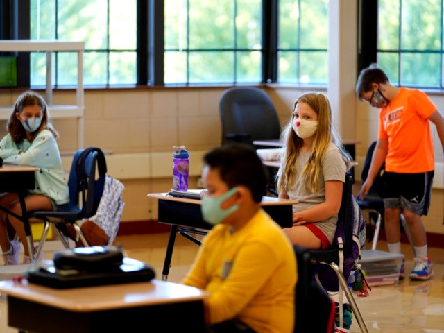 Oregon to Lift Mask Requirement 'No Later than' March 31 1 Students in fifth grade wear masks as they wait for their teacher in the classroom at Oak Terrace Elementary School in Highwood, Ill., part of the North Shore school district, on Thursday, Sept. 3, 2020. An analysis conducted by The Associated Press and Chalkbeat shows that race is a strong predictor of which public schools are offering in-person instruction to start the year and which aren't. (AP Photo/Nam Y. Huh)