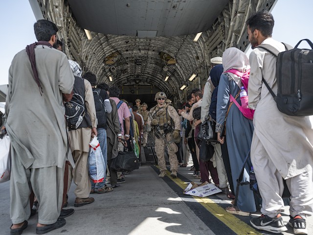 Biden's Order to Get 'F-cking Asses in Seats' Contributed to August 26 Afghanistan Attack that Killed 13 Americans 1 U.S. Airmen and U.S. Marines guide qualified evacuees aboard a U.S. Air Force C-17 Globemaster III in support of the Afghanistan evacuation at Hamid Karzai International Airport (HKIA), Afghanistan, Aug. 21, 2021. The Department of Defense is committed to supporting the U.S. State Department in the departure of U.S. and allied civilian personnel from Afghanistan and to evacuate Afghan allies to safety. (U.S. Air Force photo by Senior Airman Brennen Lege)