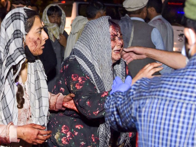 Biden's Order to Get 'F-cking Asses in Seats' Contributed to August 26 Afghanistan Attack that Killed 13 Americans 3 EDITORS NOTE: Graphic content / TOPSHOT - Wounded women arrive at a hospital for treatment after two blasts, which killed at least five and wounded a dozen, outside the airport in Kabul on August 26, 2021. (Photo by Wakil KOHSAR / AFP) (Photo by WAKIL KOHSAR/AFP via Getty Images)