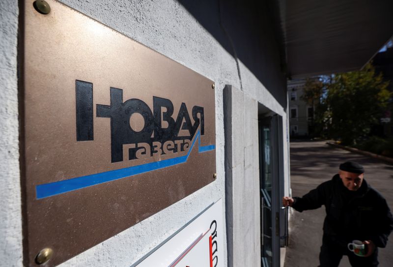 Russia’s Novaya Gazeta newspaper pauses activities after official warning 1 FILE PHOTO: Russian investigative newspaper Novaya Gazeta's plate is seen next to an entrance to the office in Moscow