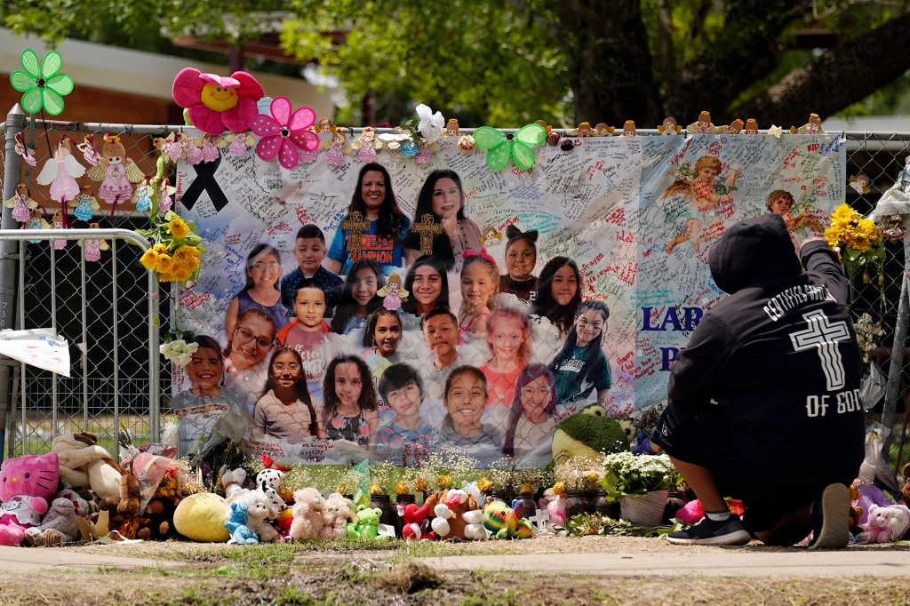 Democrats Are Worried About Biden’s 2024 Aspirations 6 A mourner stops to pay his respects at a memorial at Robb Elementary School, created to honor the victims killed in the recent school shooting.