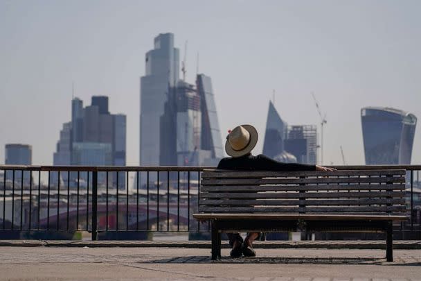 PHOTO: A man sits on a bench on the south bank of river Thames, in London, on July 18, 2022.  (Alberto Pezzali/AP Photo)