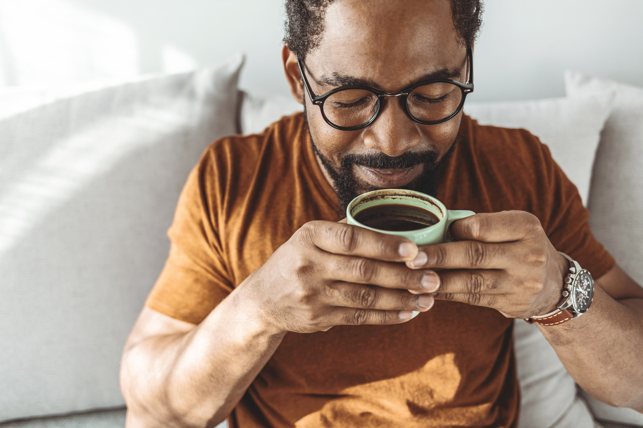 How to Dramatically Cut Your Risk of Liver Cancer 7 Man enjoying a cup of coffee.